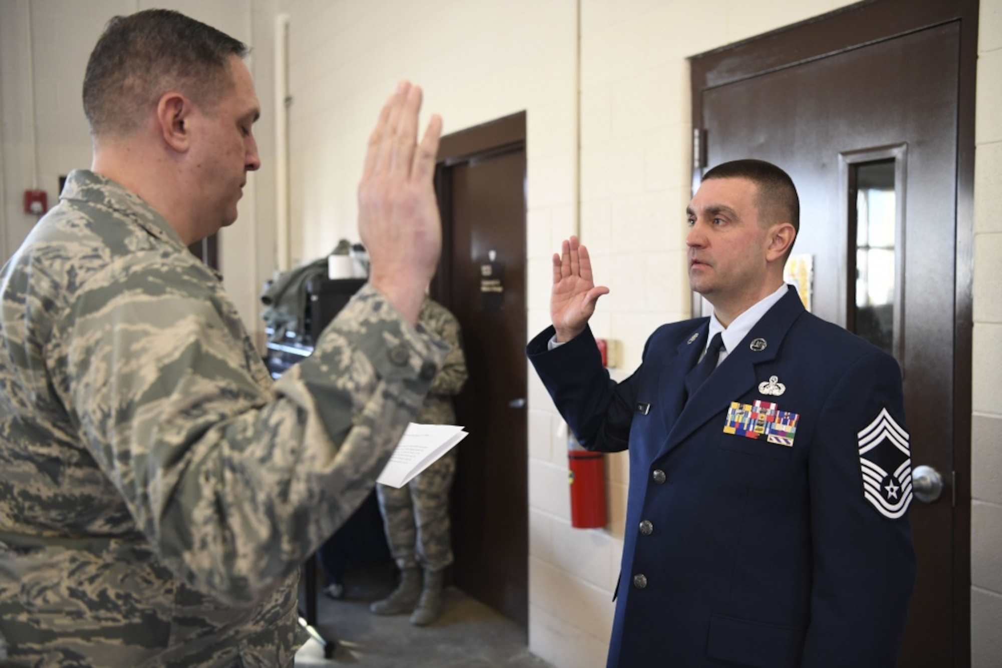 Chief Master Sgt. Mike Powell, 130th Airlift Wing communications flight chief enlisted manager, recites the Chief's Creed during a formal promotion ceremony held March 4, 2017 at McLaughlin Air National Guard Base, Charleston, W.Va. Powell was promoted to the highest enlisted rank in the Air Force after more than 23 years in the West Virginia Air National Guard. (U.S. Air National Guard photo by Tech. Sgt. Eugene Crist) 