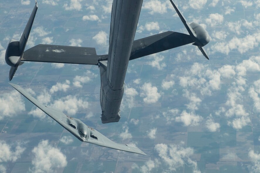 A B-2 Spirit from Whiteman Air Force Base, Mo. backs away and banks left after receiving fuel from a KC-10 Extender from Joint Base McGuire-Dix-Lakehurst, N.J. during a Mobility Exercise held by JB MDL. The Joint Base holds an annual MOBEX in Gulfport, Miss. to practice deploying and operating in a deployed environment.(U.S. Air Force photo by Senior Airman Joshua King)