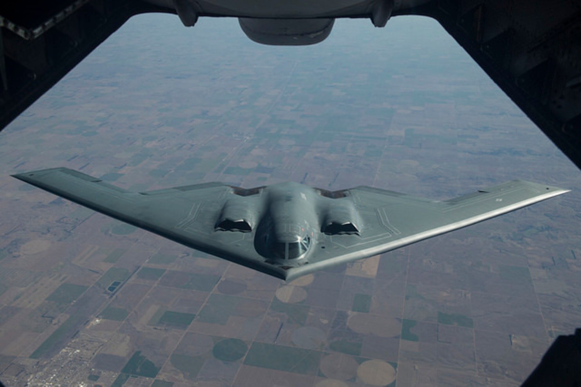 A B-2 Spirit from Whiteman Air Force Base, Mo. backs away after receiving fuel from a KC-10 Extender from Joint Base McGuire-Dix-Lakehurst, N.J. during a Mobility Exercise held by JB MDL. The Joint Base holds an annual MOBEX in Gulfport, Miss. to practice deploying and operating in a deployed environment.(U.S. Air Force photo by Senior Airman Joshua King)