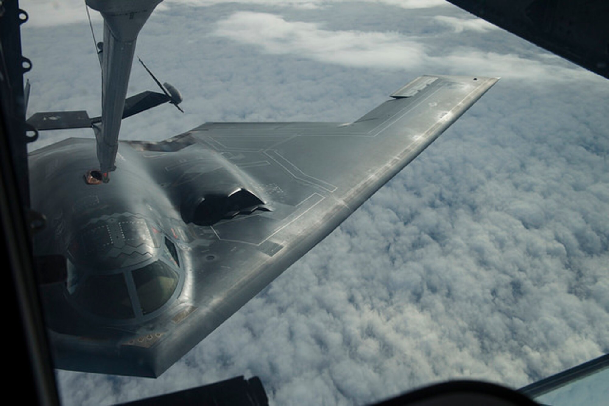 A B-2 Spirit from Whiteman Air Force Base, Mo. receives fuel from a KC-10 Extender from Joint Base McGuire-Dix-Lakehurst, N.J. during a Mobility Exercise held by JB MDL. The Joint Base holds an annual MOBEX in Gulfport, Miss. to practice deploying and operating in a deployed environment.(U.S. Air Force photo by Senior Airman Joshua King)