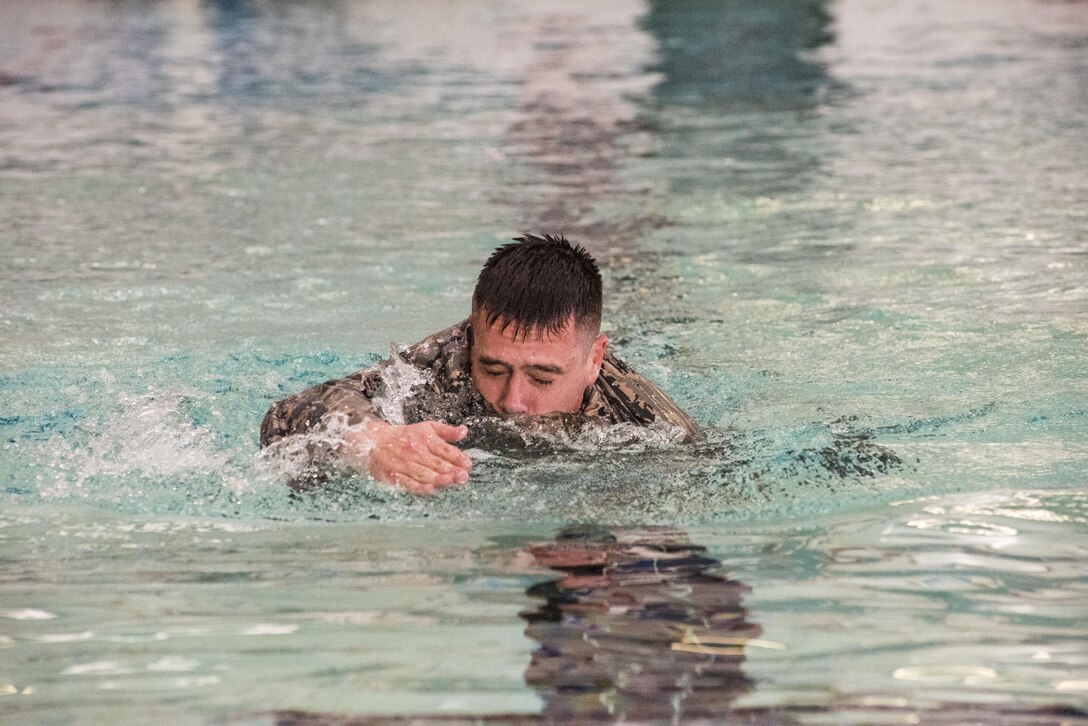 Capt. Juan Cabrera, 419th Security Forces Squadron commander, swims 50 meters while in uniform March 4, 2017 at Hill Air Force Base, Utah, in preparation for tryouts for the Interallied Confederation of Reserve Officers Military Competition to take place August 2017 in Prague, Czech Republic. (U.S. Air Force photo/Senior Airman Justin Fuchs)