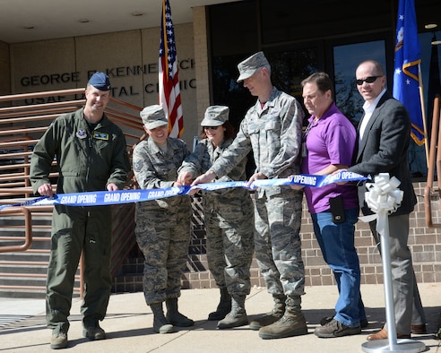 Col. Ty Newman, left, 2 Bomb Wing Commander, joined the 2nd Dental Squadron staff and community partners for a ribbon cutting ceremony at Barksdale Air Force Base, La., March 3,2017. The building is a one story modern facility constructed in 1976. It consists of 40 treatment rooms equipped with modern dental units and a Central Instrument Sterilization Processing Center. The renovation took two years and 28 days., included a 1,763 square-foot addition, a gain of three treatment rooms, including new dental chairs and cabinetry, and a new lobby.The Dental Squadron has four flights with 65 authorized military and civilian personnel. It provides dental care to over 5, 300 active duty Airmen. Barksdale's 2nd DS clinic is named after Major General George R. Kennebeck, the first Assistant Surgeon General for Dental Services. (U.S. Air Force photo by Nevardo Cayemitte/Released)