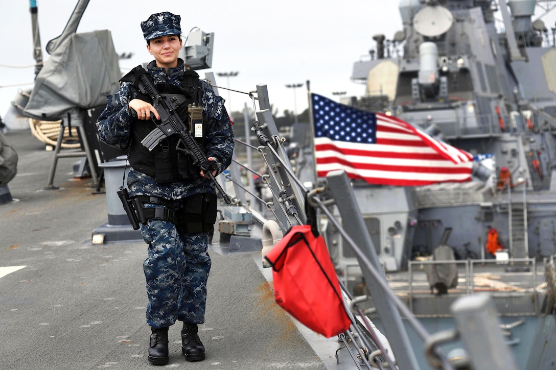 Navy Petty Officer 3rd Class Samantha Rivera stands watch aboard the USS Porter while the ship is pierside at Naval Station Rota, Spain, March 5, 2017. Rivera is a ship's serviceman. Navy photo by Petty Officer 3rd Class Ford Williams