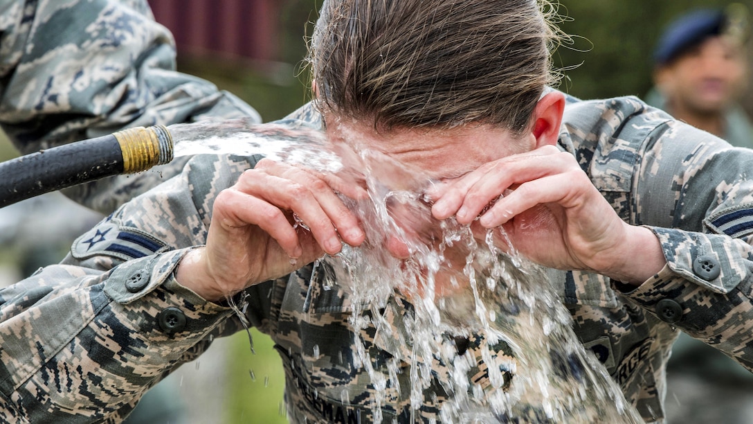 Air Force Airman 1st Class Kameron Freeman washes her eyes after being pepper sprayed during training at McLaughlin Air National Guard Base, W.Va., March 4, 2017. Freeman is assigned to the 130th Airlift Wing Security Forces Squadron. Security forces members must train to experience pepper spray and deal with its effects. Air National Guard photo by Tech. Sgt. De-Juan Haley
 