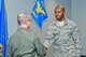 U.S. Air Force Reserve Lt. Col. Vito Carabetta, flight surgeon, 913th Aerospace Medical Squadron, congratulates Staff Sgt. Markell Smith, medical logistics technician, 913 AMDS, after reenlisting him at Little Rock Air Force Base, Ark., March 4, 2017. Re-enlisting in the Air Force Reserve is not guaranteed, and requires Airmen to meet certain standards in their chosen career field, in addition to maintaining the set standard of physical fitness for their age group. (U.S. Air Force photo by Master Sgt. Jeff Walston/Released)