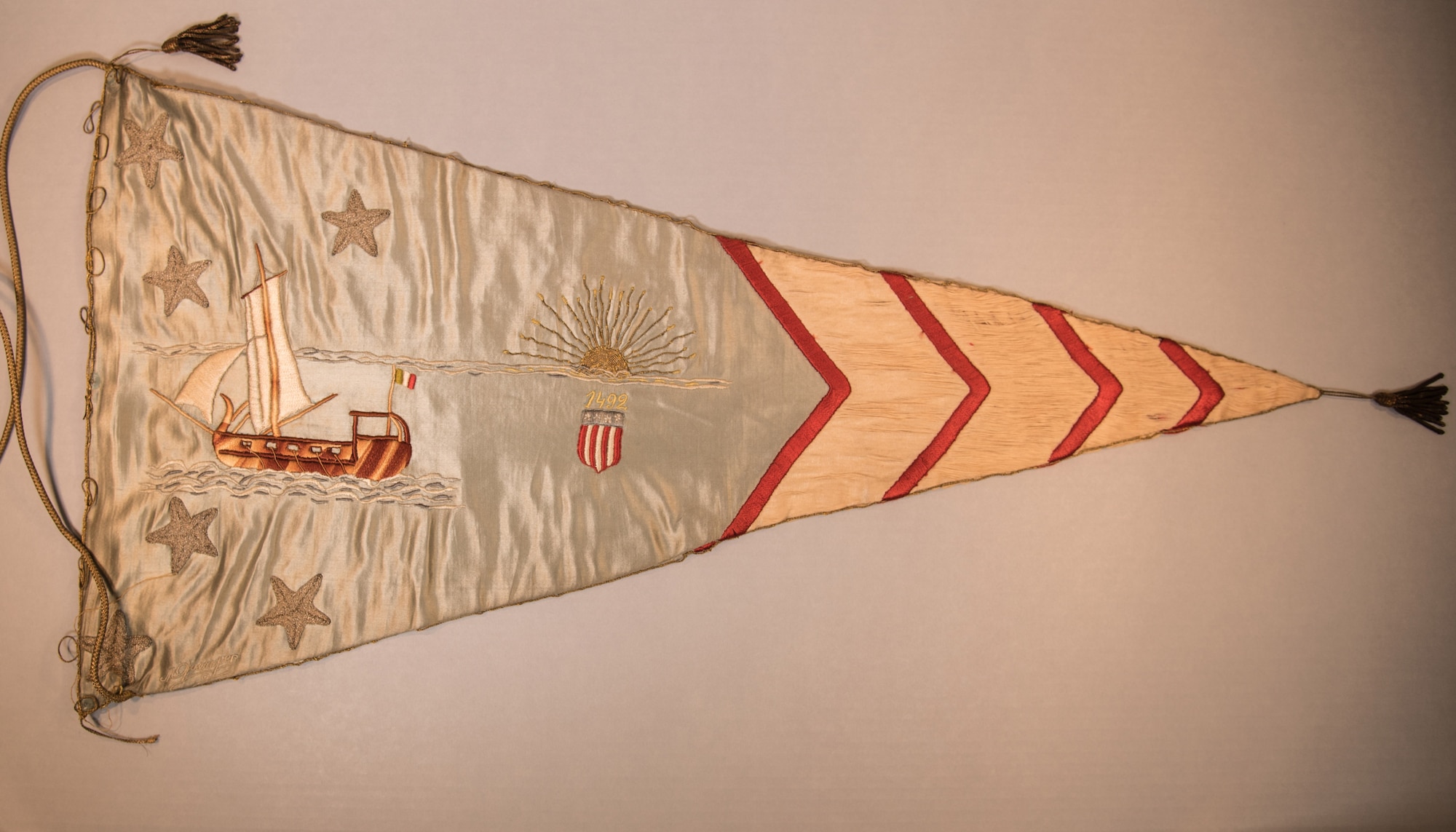 On April 12, 1919, a flag presentation ceremony was held in Paris in honor of the Air Service, A.E.F. Hundreds of banners, hand made by French women, were presented to representatives of the various U.S. squadrons that had served in France during WWI. Five of theses pennants are on display in the museum's Early Years Gallery. This item is currently in storage. (U.S. Air Force photo by Ken LaRock)