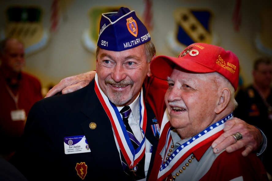 Retired U.S. Army Major Ron Chatelaine, Military Order of the Purple Heart Chapter 351 commander, hugs a fellow veteran during the 38th Annual Veterans’ Luncheon at Barksdale Air Force Base, La., and March, 3, 2017. Chatelaine joined 2nd Bomb Wing leadership to greet veterans during the Parade of Heroes. (U.S. Air Force photo/Senior Airman Mozer O. Da Cunha)