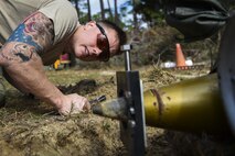 Airman 1st Class Lawrence Gress, an explosive ordinance disposal journeyman with the 1st Special Operations Civil Engineer Squadron, checks the jaw assembly of an MK1 rocket wrench during EOD tool training at Hurlburt Field, Fla., Mar. 6, 2017. If the rocket wrench is not straight, it may not properly remove the fuse and could cause damage to the tool. (U.S. Air Force photo by Airman 1st Class Joseph Pick)