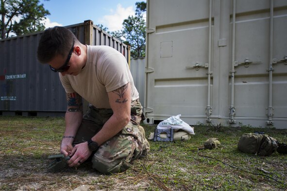 Airman 1st Class Lawrence Gress, an explosive ordinance disposal journeyman with the 1st Special Operations Civil Engineer Squadron, tests the .50 caliber blank rounds of an MK1 rocket wrench during EOD tool training at Hurlburt Field, Fla., Mar. 6, 2017. The electrical detonation of the two .50-caliber blank rounds causes the rocket wrench to spin rapidly, removing the fuse attached to the ordnance in the process. (U.S. Air Force photo by Airman 1st Class Joseph Pick)