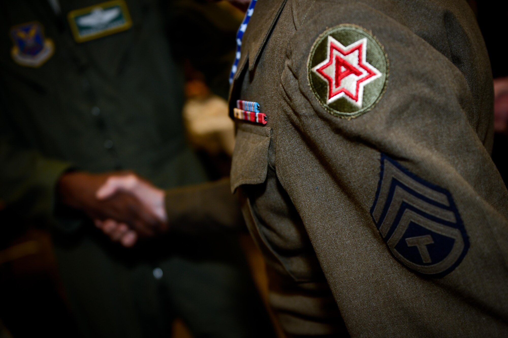 Col. Brandon Parker, 2nd Bomb Wing vice commander, greets a veteran during the 38th Annual Veterans’ Luncheon at Barksdale Air Force Base, La., March, 3, 2017. Veterans showed service pride by wearing uniforms dating back to World War II. (U.S. Air Force photo/Senior Airman Mozer O. Da Cunha)