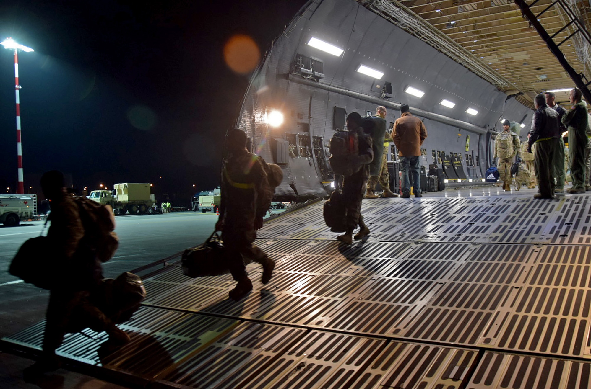 U.S. Army Soldiers belonging to the 10th Combat Aviation Brigade from Ft. Drum, N.Y. walk off the ramp of a C-5M Super Galaxy at  Riga, Latvia, to begin their nine-month deployment in support of Operation Atlantic Resolve on Mar. 4, 2017. (U.S. Air Force photo/Tech. Sgt. Carlos J. Trevino)

