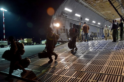 U.S. Army Soldiers belonging to the 10th Combat Aviation Brigade from Ft. Drum, N.Y. walk off the ramp of a C-5M Super Galaxy at  Riga, Latvia, to begin their nine-month deployment in support of Operation Atlantic Resolve on Mar. 4, 2017. (U.S. Air Force photo/Tech. Sgt. Carlos J. Trevino)

