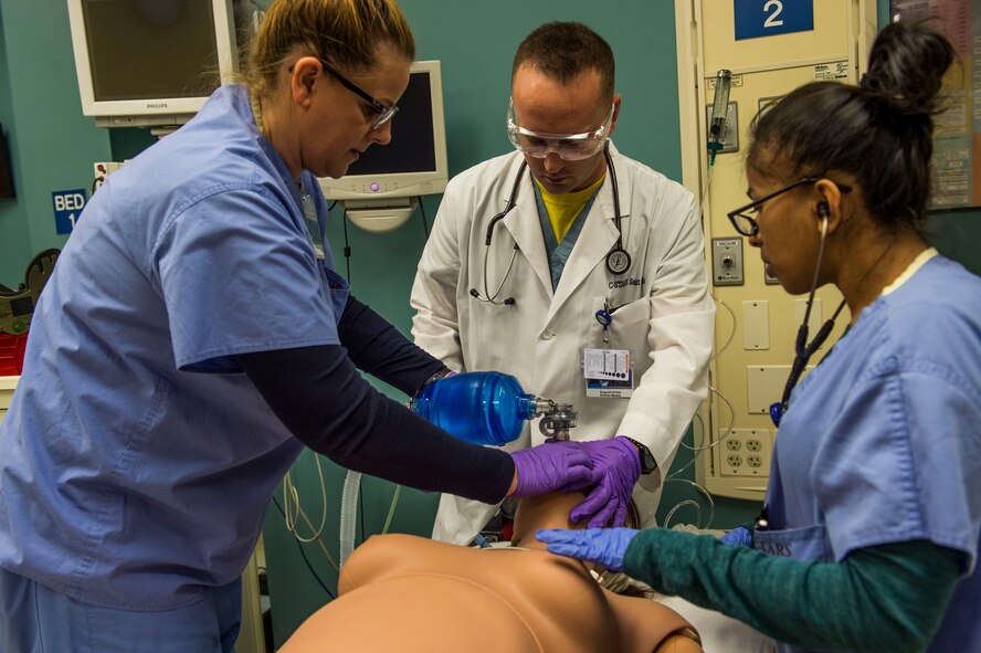 Master Sgt. Barbara Lay, 60th Medical Group, Capt. Andrew Morton, 82nd Medical Operations Squadron and Senior Airman Alonne Ochoa Pacheco, 99 MDOS, run through a simulation training using Athena in St. Louis, Missouri.  The simulator has female features and offers advanced ventilation technology, serving as a vital piece to providing the best medical training possible for students completing the program.  (U.S. Air Force Photo / SSgt Jodi Martinez)