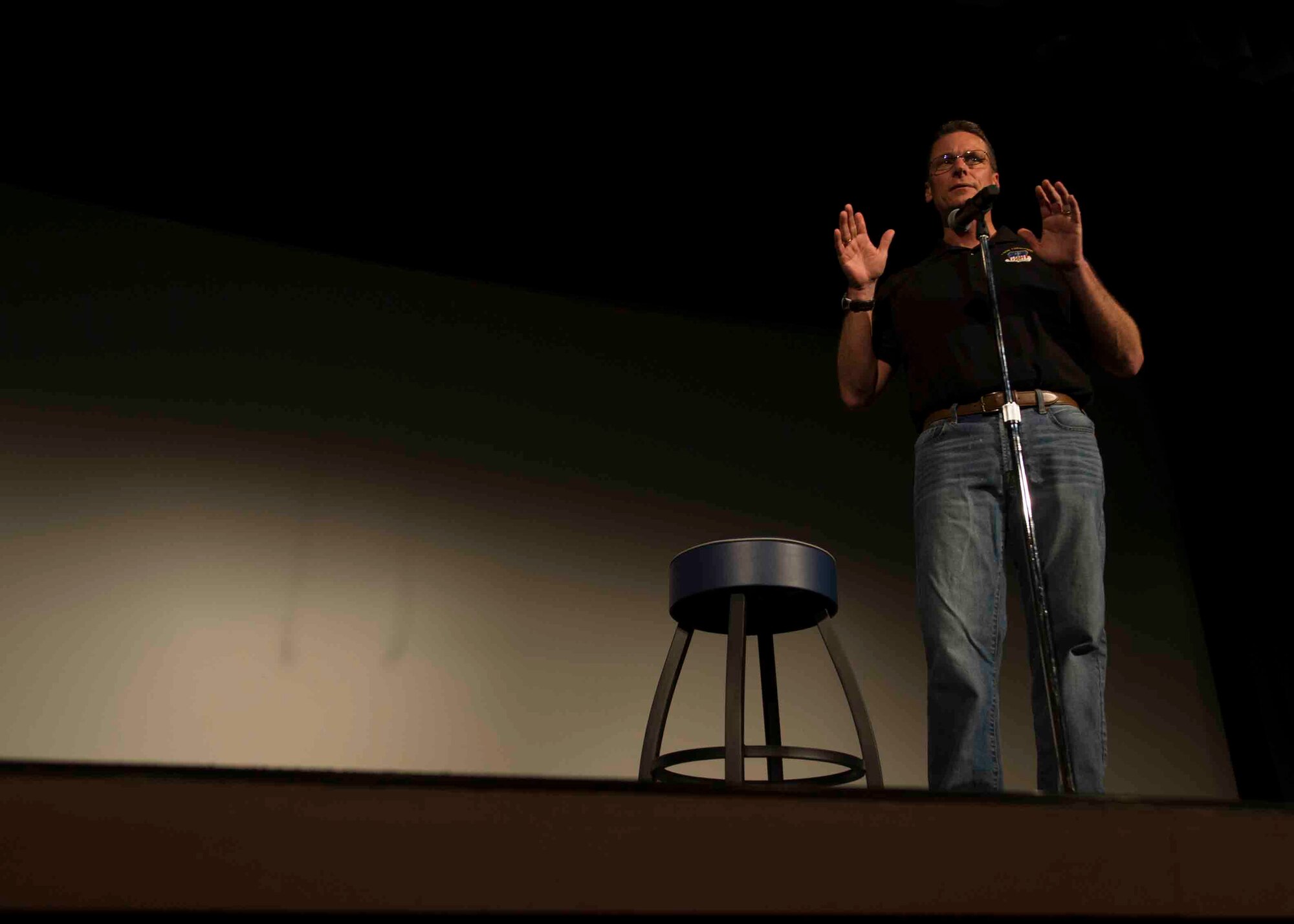 Col. Tom Palenske, commander of the 1st Special Operations Wing, tells a joke prior to a comedy show featuring Walter Campbell and Ben Bailey at the King Auditorium on Hurlburt Field, Fla., March 3, 2017. The 1st Special Operations Force Support Squadron, in conjunction with Air Forces Services Agency, hosted the free event to invest in the resiliency of the force and family. (U.S. Air Force photo by Airman 1st Class Isaac O. Guest IV)