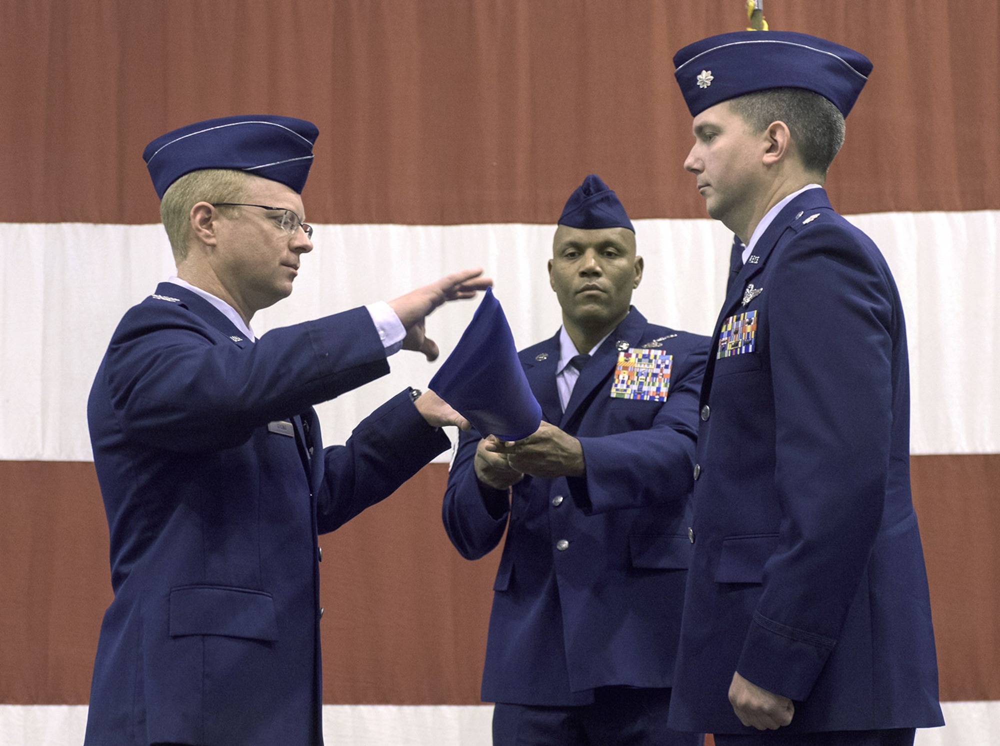 Col. Matthew Atkins, 361st Intelligence, Surveillance and Reconnaissance Group Commander, Hurlburt Field, Fla., unfurls the 361st guidon during an assumption of command ceremony hosted by the 137th Special Operations Wing, Mar. 6, at Will Rogers Air National Guard Base, Oklahoma City. Lt. Col. Stephen McFadden received the guidon as he took command of the 306th Intelligence Squadron, formerly located at Beale Air Force Base, California, upon its activation at WRANGB. (U.S. Air National Guard photo by Staff Sgt. Kasey Phipps)