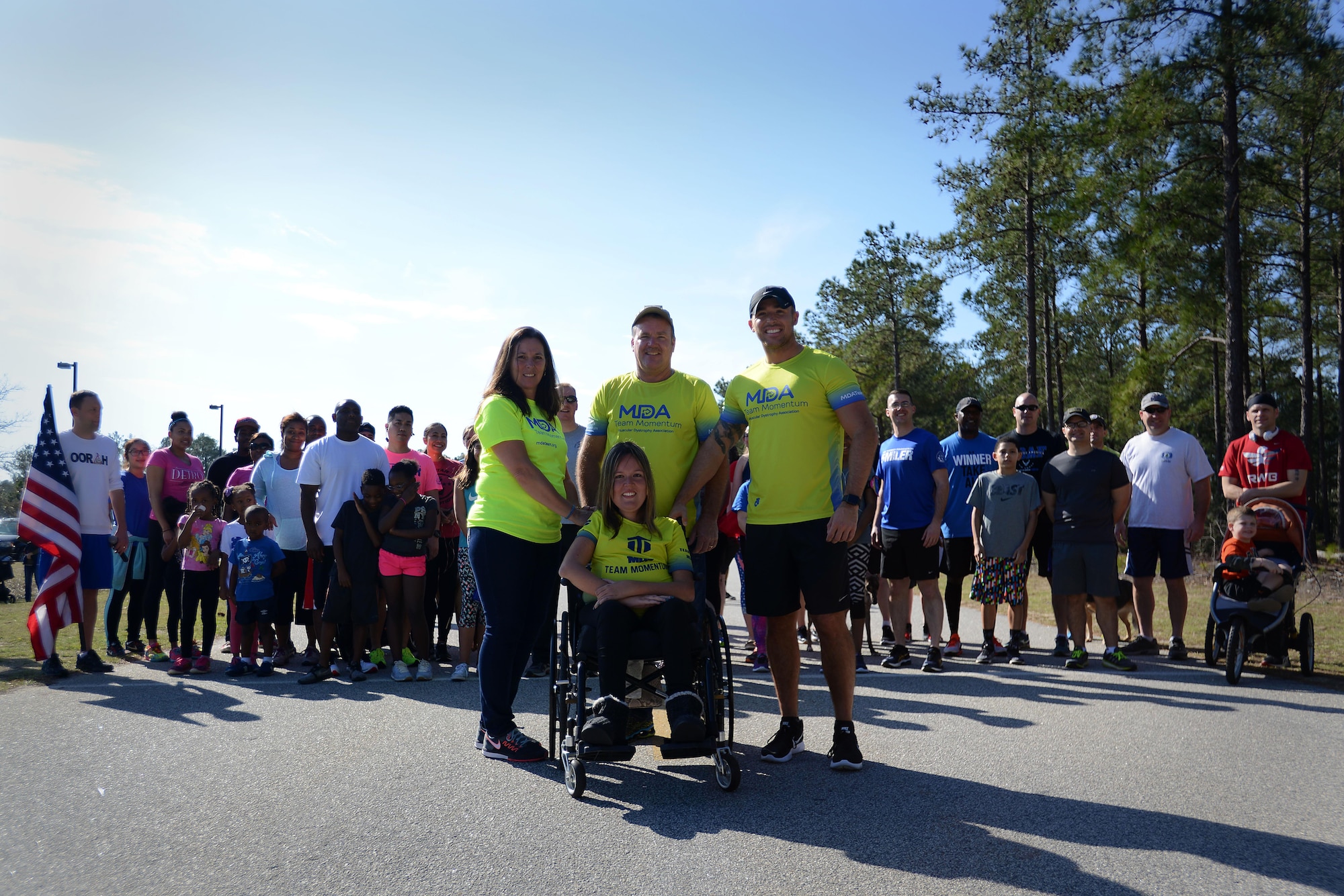 U.S. Air Force Senior Airman Michael Hall, 20th Aerospace Medicine Squadron flight and operation medical technician, center right, stands with his family and fellow runners before a 5K at Shaw Air Force Base, S.C., Feb. 25, 2017. The 20th Medical Group held the race to raise awareness for muscular dystrophy and to help Hall reach his goal of $10,000 in donations for the Muscular Dystrophy Association. (U.S. Air Force photo by Airman 1st Class Kelsey Tucker)