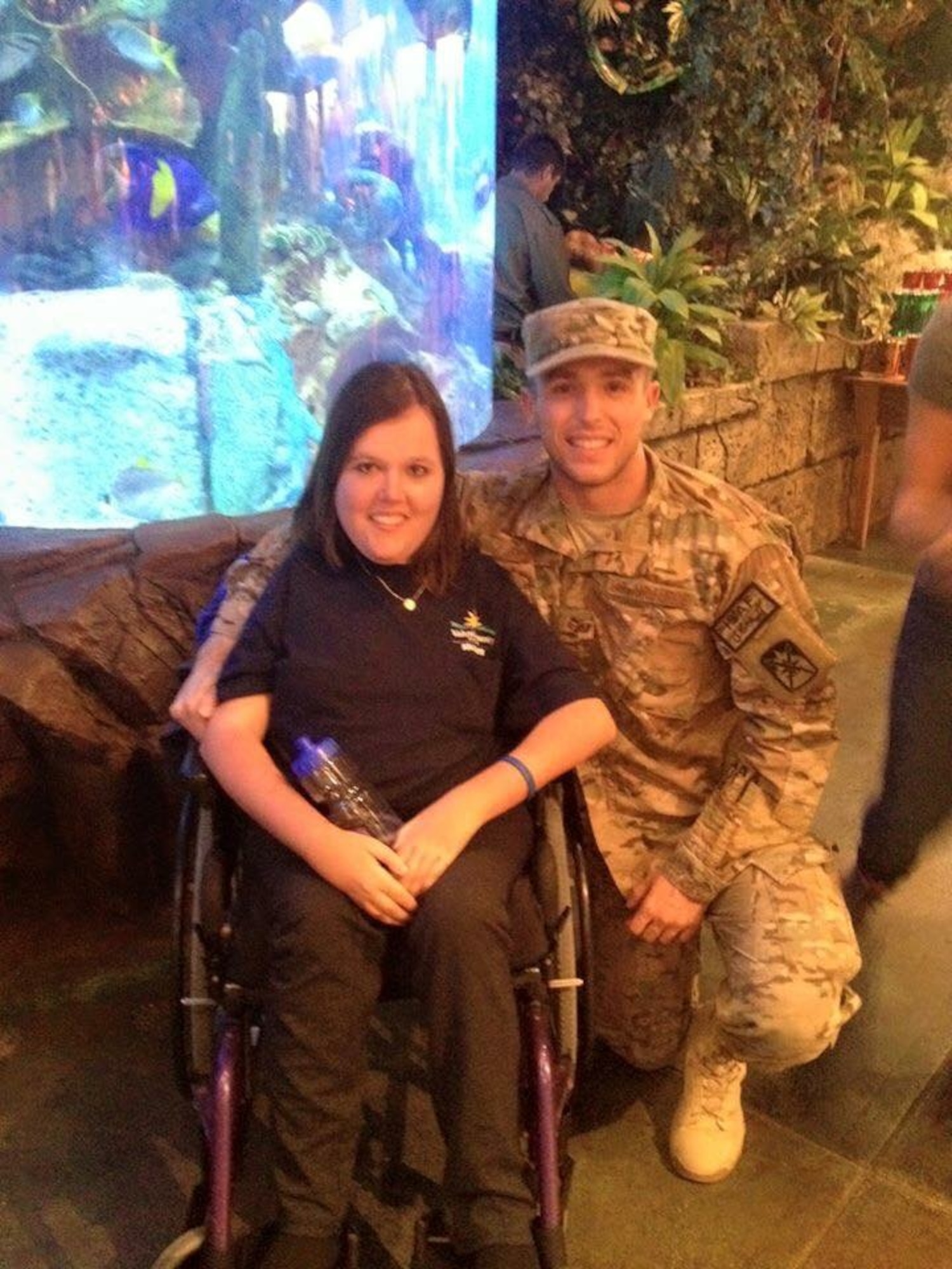 U.S. Air Force Senior Airman Michael Hall, 20th Aerospace Medicine Squadron flight and operation medical technician, poses with his sister in Orlando, Fla., Oct. 17, 2014. Hall surprised his family after coming home from a nearly eight month deployment to Bagram Airfield, Afghanistan. (Courtesy photo)