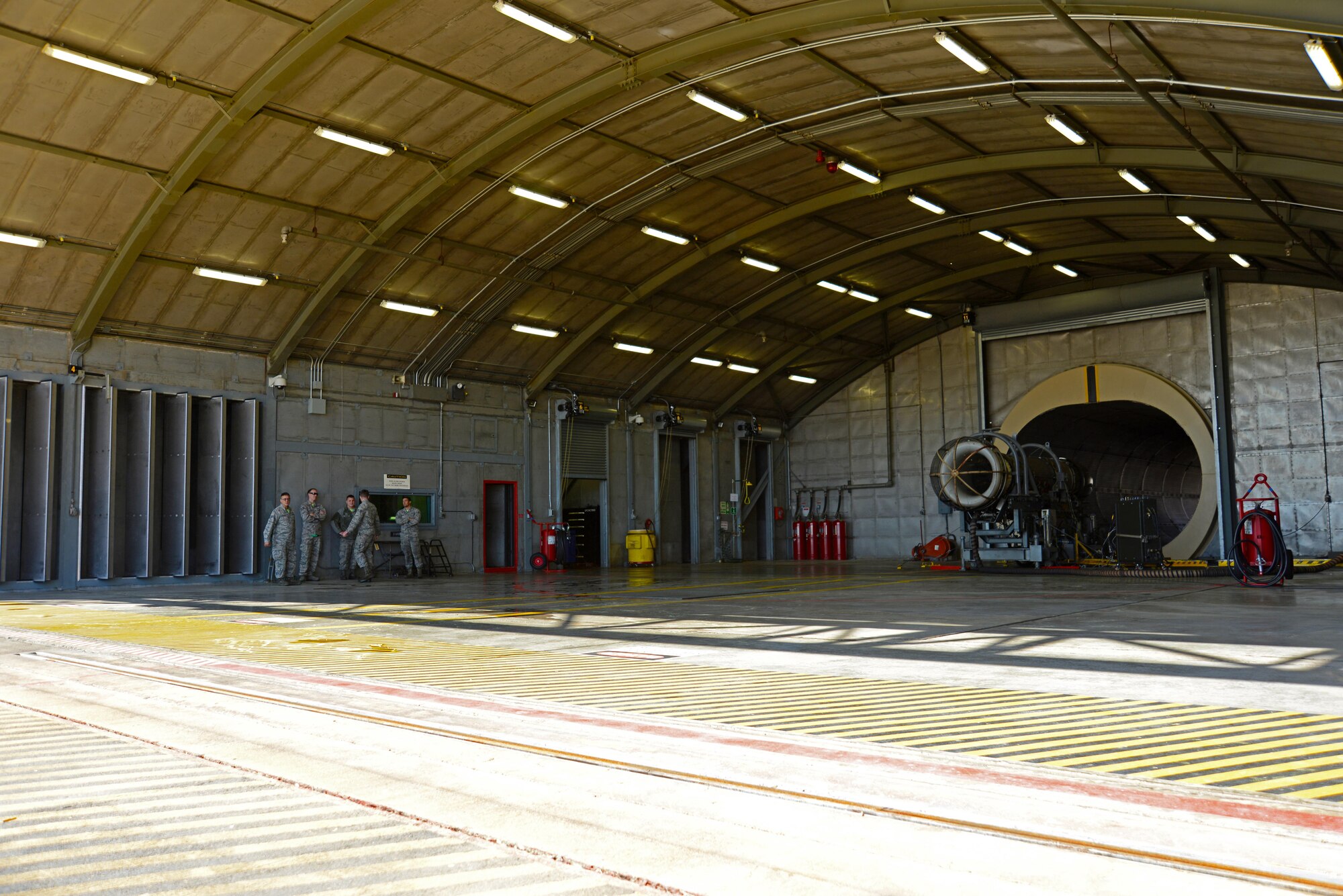 U.S. Airmen from the 20th Component Maintenance Squadron gather at a test cell facility at Shaw Air Force Base, S.C., March 3, 2017. Airmen at the facility are responsible for testing F-16CM Fighting Falcon engines to ensure they function safely. (U.S. Air Force photo by Airman 1st Class Kathryn R.C. Reaves)