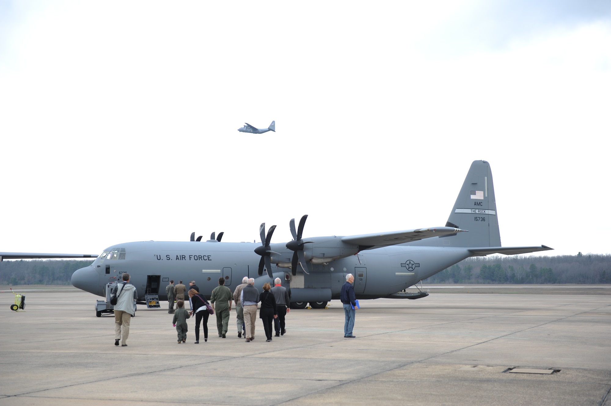 Visitors to the 41st Airlift Squadron receive a tour of a C-130J Super Hercules during a reunion March 24, 2017, on Little Rock Air Force Base, Ark. The reunion honored the 75th anniversary of the 41st AS. (U.S. Air Force photo by Airman 1st Class Grace Nichols)