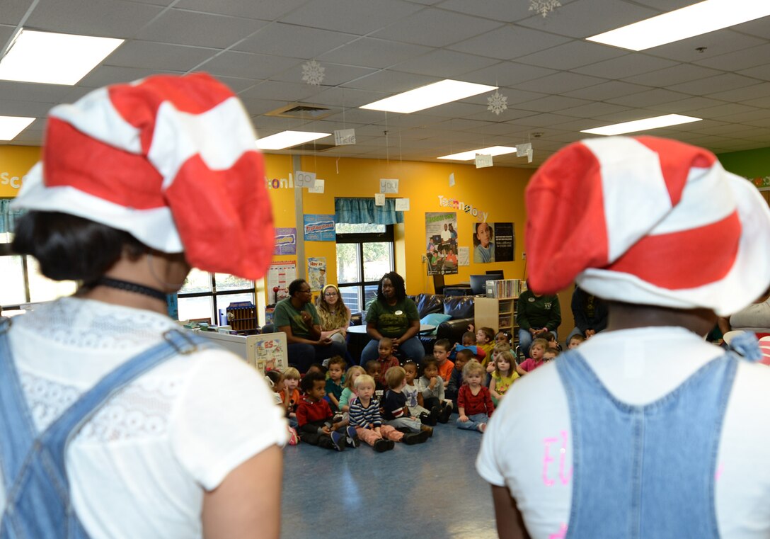 Marine Corps Logistics Base Albany’s Child Development Center children watch Radium Springs Middle Magnet School students perform skits in recognition of Read Across America, 
March 3.