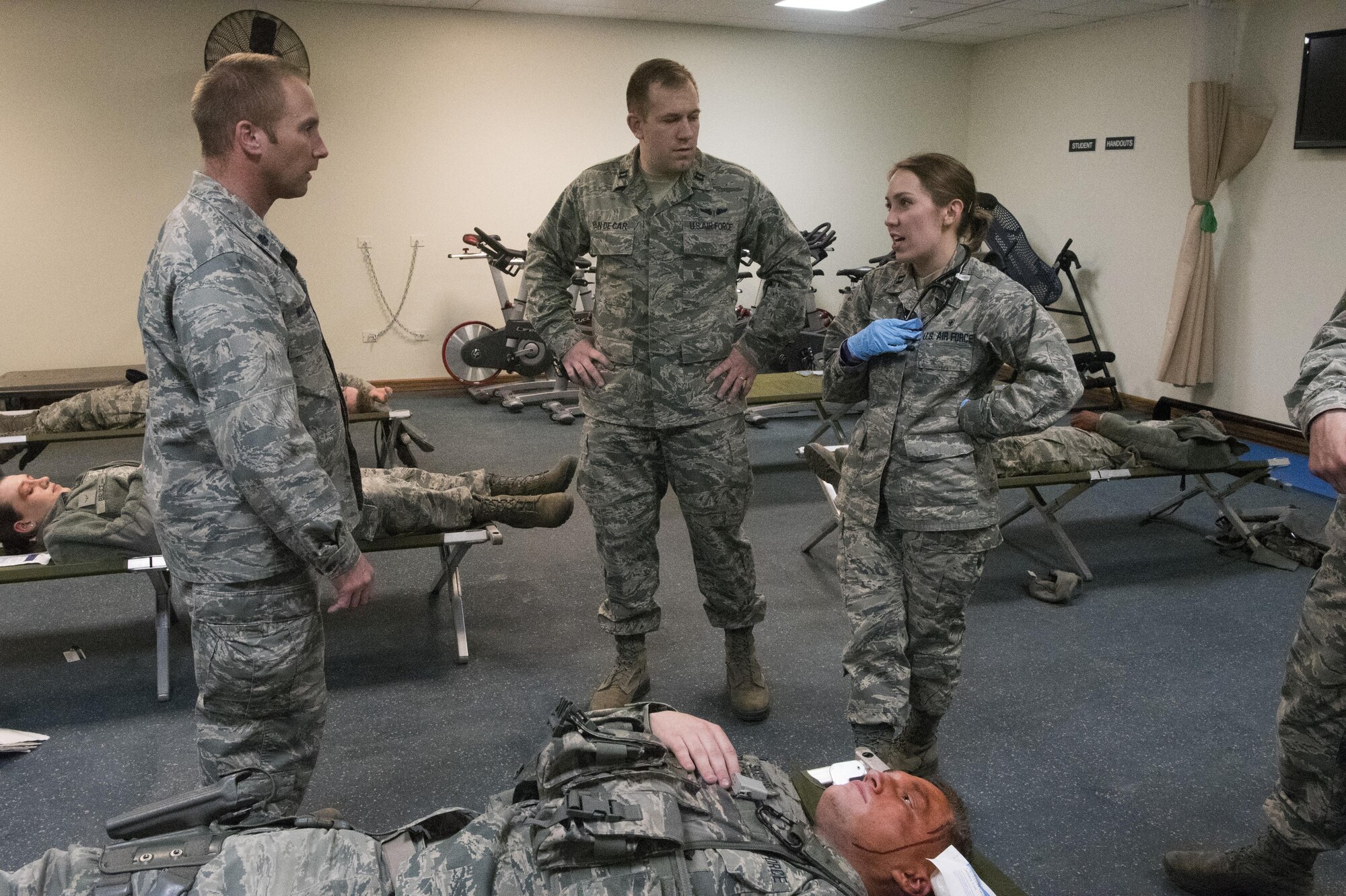 PETERSON AIR FORCE BASE, Colo. –  Airmen of the Cheyenne Mountain Air Force Station Medical Aid Station conduct an after action briefing during button-up contingency triage training at the Cheyenne Mountain AFS, Colo., March 3, 2017. The training is designed to stress Cheyenne Mountain AFS medical responders, who are on call from Peterson Air Force Base Medical Clinic, to simulate the stress that a future buttoned up mass casualty event could cause.. (U.S. Air Force photo by Steve Kotecki)