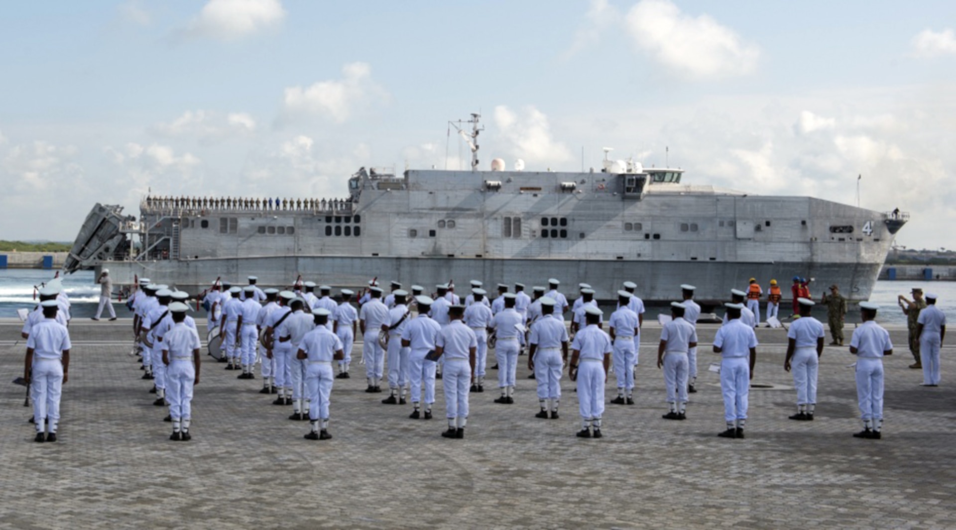 The Sri Lanka Navy Band performs as the expeditionary fast transport ship USNS Fall River (T-EPF-4) arrives in Hambantota to participate in Pacific Partnership 2017 mission stop Sri Lanka, Mar. 7, 2017.   Pacific Partnership is the largest annual multilateral humanitarian assistance and disaster relief preparedness mission conducted in the Indo-Asia-Pacific and aims to enhance regional coordination in areas such as medical readiness and preparedness for manmade and natural disasters. 