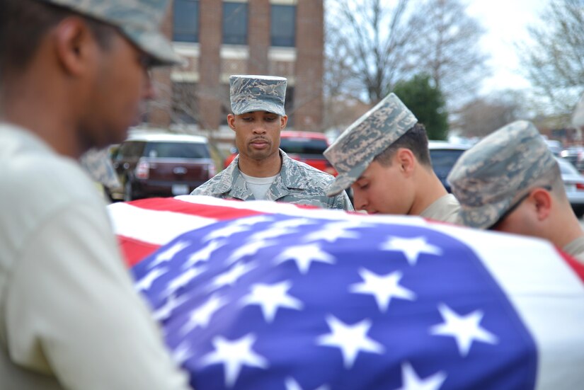 U.S. Air Force Staff Sgt. Quinton Gittens, 633rd Force Support Squadron readiness NCO in charge, assesses the honor guard team during training at Joint Base Langley-Eustis, Va., March 1, 2017. The team practiced a detail that would be performed during a funeral service. (U.S. Air Force photo by Airman 1st Class Tristan Biese)