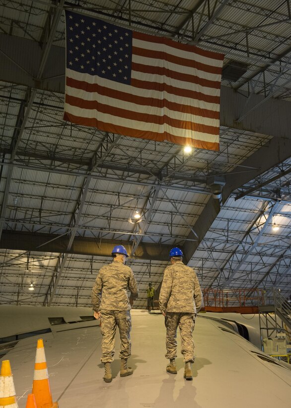 Senior Airman John Weaver, 436th Maintenance Squadron crew chief, and Lt. Gen. Sam Cox, 18th Air Force commander, walk on a C-5M Super Galaxy’s wing during a tour of the 436th Maintenance Squadron’s Isochronal Maintenance Dock March 1, 2017, at Dover Air Force Base, Delaware. During an ISO inspection, aircraft maintainers strip down the C-5 looking for any deficiencies, faults, cracks or other problems in every system of the aircraft. (U.S. Air Force photo by Senior Airman Zachary Cacicia)