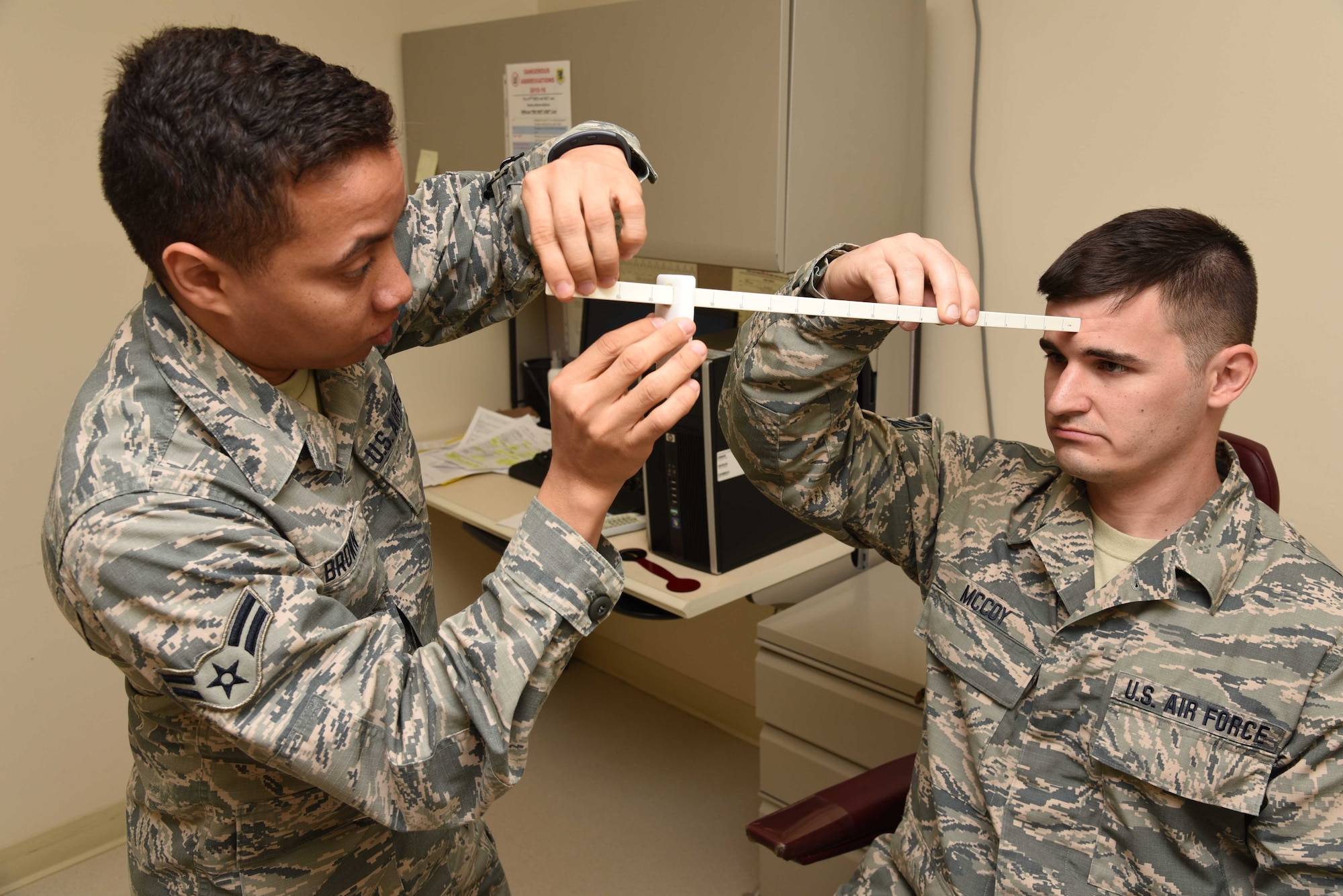 Airman 1st Class Michael Brown, 403rd Aeromedical Staging Squadron ophthalmic technician, performs a near-point-of-convergence test during a routine eye exam on Staff Sgt. Matthew McCoy, 403rd Aircraft Maintenance Squadron crew chief Feb. 10, at Keesler Air Force Base, Mississippi. One of the roles of ASTS is to make sure that the wing’s Citizen Airmen are healthy and fit for service worldwide. (U.S. Air Force photo/Tech. Sgt. Ryan Labadens)