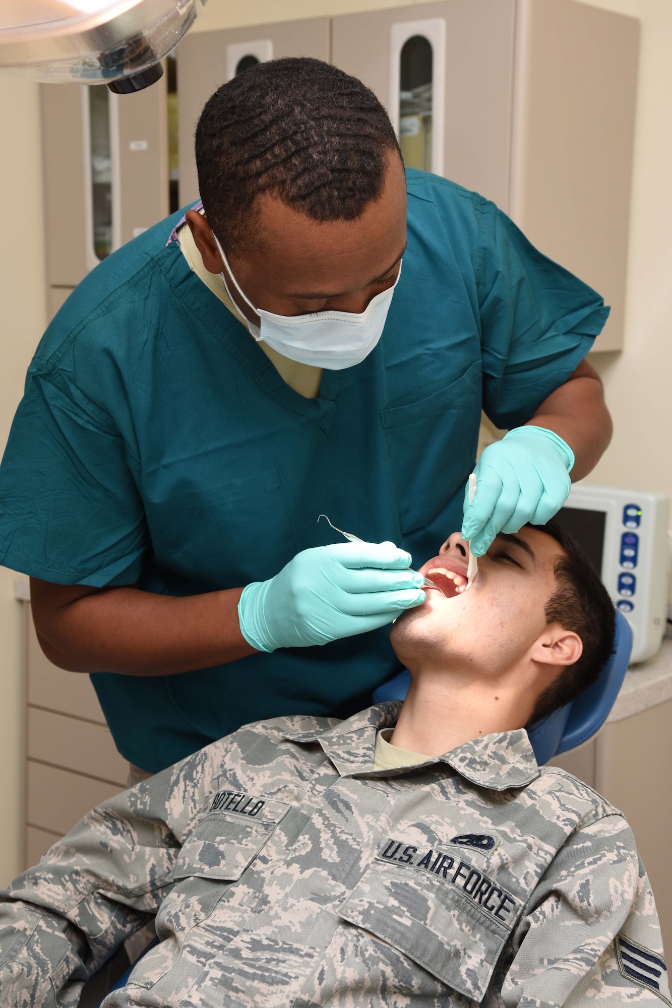 Lt. Col. Jeffrey Brown, 403rd Aeromedical Staging Squadron chief dental officer, performs a routine dental exam on Senior Airman Cristian Botello, 403rd Aerospace Maintenance Squadron aerospace propulsion journeyman Feb. 10 at Keesler Air Force Base, Mississippi. One of the roles of ASTS is to make sure that the wing’s Citizen Airmen are healthy and fit for service worldwide. (U.S. Air Force photo/Tech. Sgt. Ryan Labadens)