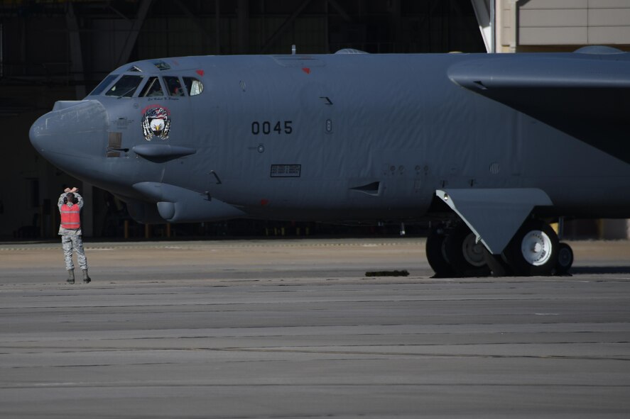 A B-52 Stratofortress with U.S. Air Force Lt. Col. Steve Smith, 93rd Bomb Squadron flight instructor, on board marshals from its spot on the flightline at Barksdale Air Force Base, La., March 3, 2017.   The flight gave Smith more than 10,000 flight hours in the B-52 Stratofortress, more than any other flight crew members currently serving in the Air Force. (U.S. Air Force photo by Tech. Sgt. Ted Daigle/Released)