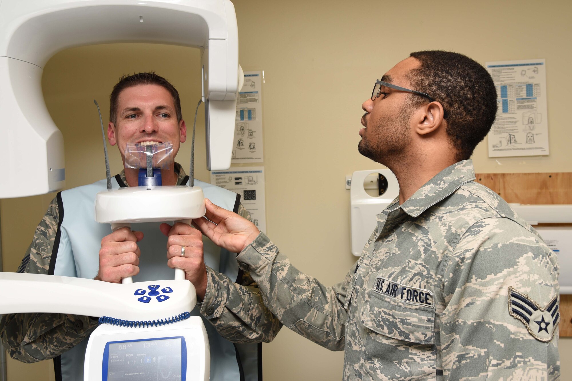 Senior Airman Marlon Lampkin, 403rd Aeromedical Staging Squadron X-ray technician, prepares Senior Master Sgt. Thomas Lassabe, 403rd Fabrications Flight superintendent, for an X-ray during a routine dental exam Feb. 10 at Keesler Air Force Base, Mississippi. One of the roles of ASTS is to make sure that the wing’s Citizen Airmen are healthy and fit for service worldwide. (U.S. Air Force photo/Tech. Sgt. Ryan Labadens)