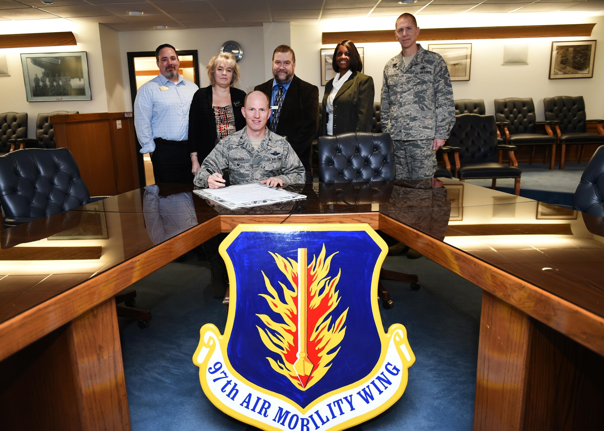 U.S. Air Force Col. Charles Ohliger, 97th Air Mobility Wing vice commander, signs a proclamation for the start of Military Saves Week, Feb. 22, 2017, at Altus Air Force Base, Oklahoma. Military Saves Week aims to educate and inspire military members and their families to save money, reduce debt and build wealth. (U.S. Air Force Photo by Airman 1st Class Kirby
Turbak/Released).