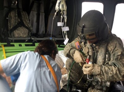 Members of the 1-228 AVN’s MEDEVAC Company transport a critically ill U.S. military retiree from a hospital in Siguatepeque to Tegucigalpa for further care Feb 18.  The MEDEVAC Company is assigned to Joint Task Force – Bravo at Soto Cano Air Base in Honduras.  The company trains daily for critical missions such as these and on this day were able to put all their training and skills into action for a real world mission that helped save a life. (Courtesy photo)