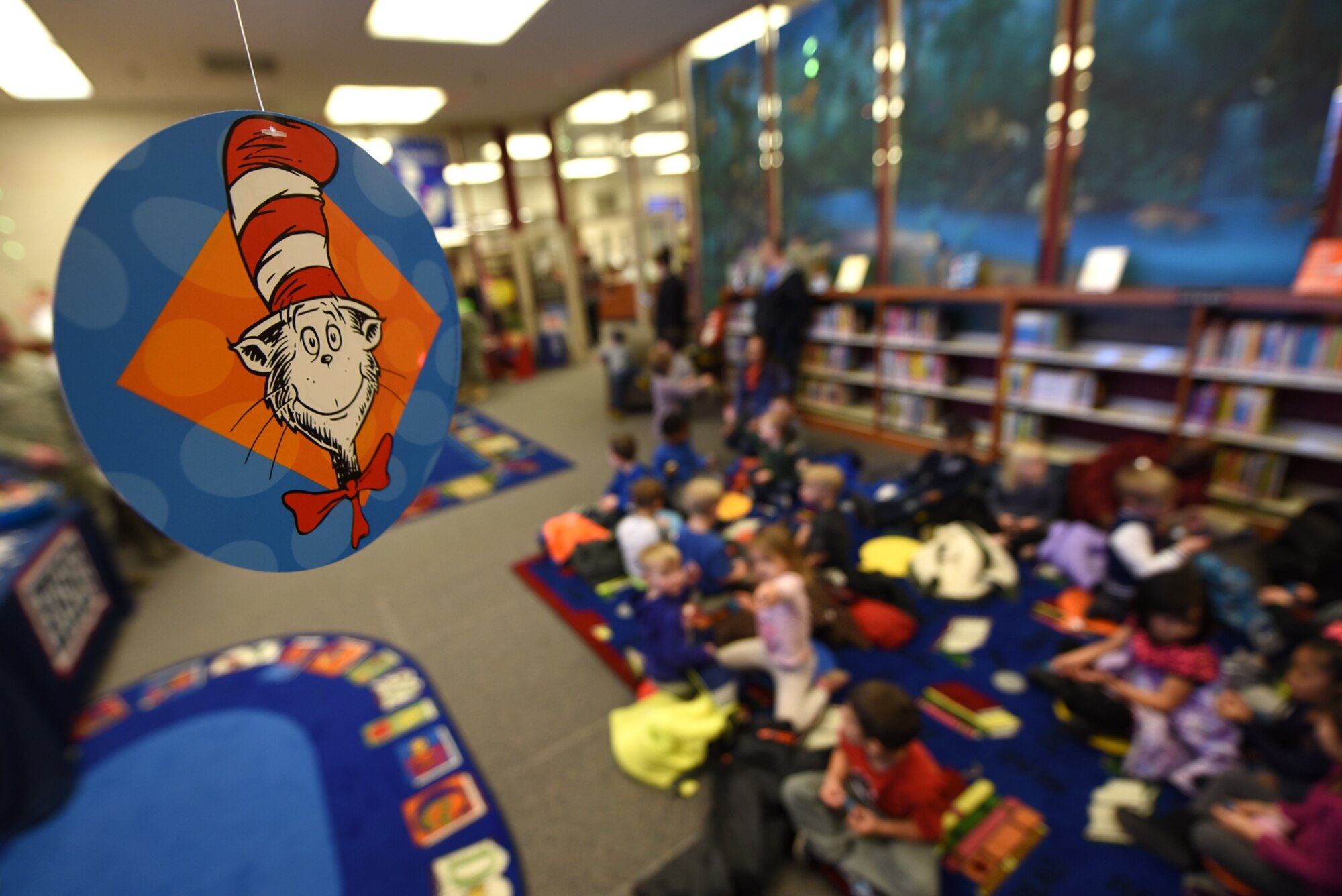 PETERSON AIR FORCE BASE, Colo. – Team Pete children gather in the Peterson Library for Seussabration to hear Dr. Seuss stories read to them by special guests at Peterson Air Force Base, Colo., March 2, 2017. The event involved games, prizes and readings by Airmen from all over the base. (U.S. Air Force photo by Airman 1st Class Dennis Hoffman)