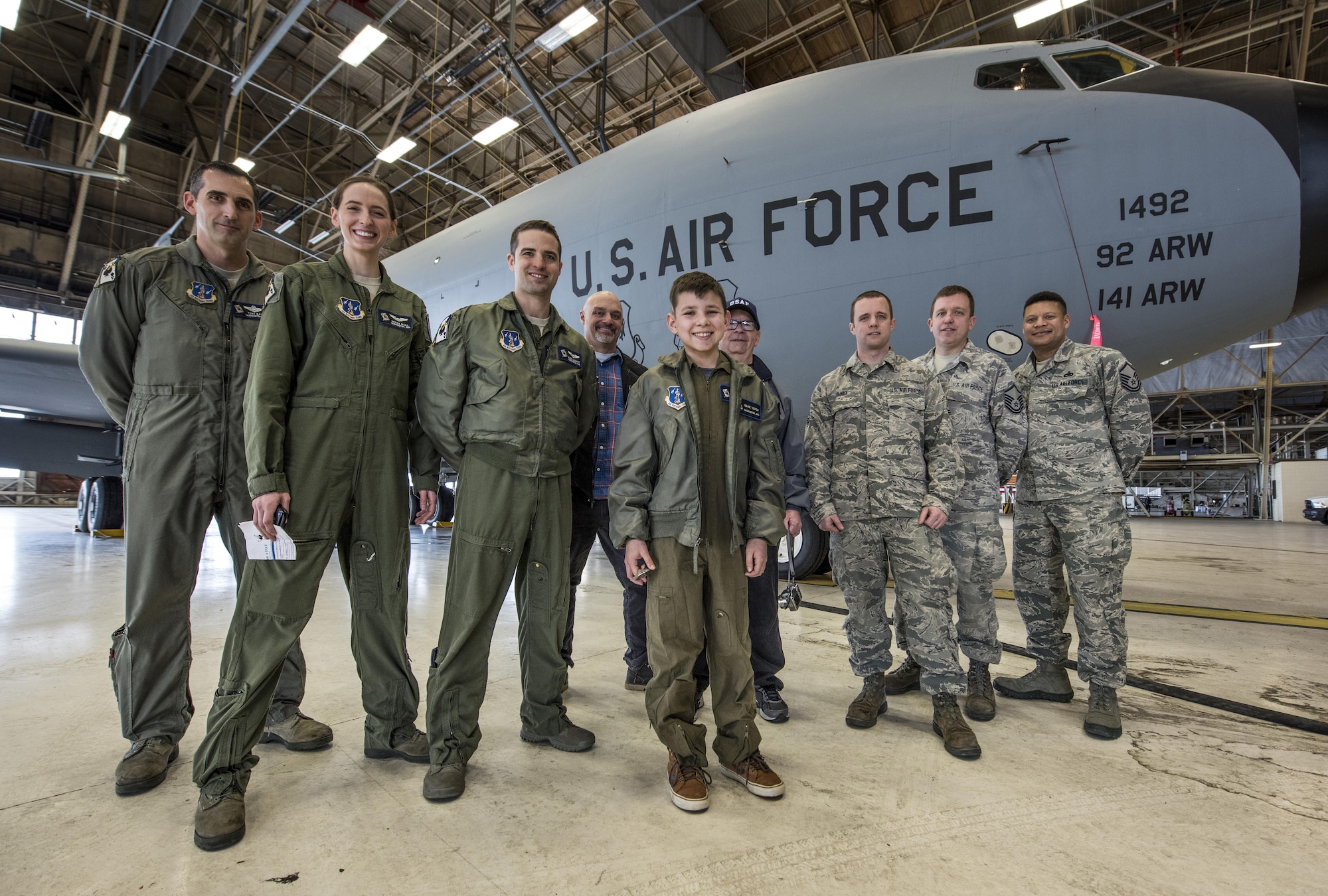 Members of the 141st Air Refueling Wing pose with "Pilot for a Day" candidate Gabe Tesch during a tour of a KC-135 Stratotanker static display Mar. 1, 2017, at Fairchild Air Force Base, Washington. Gabe spent the day visiting several work centers throughout the base receiving hands on instruction and briefings on what it takes to be a KC-135 pilot. The "Pilot for a Day" program provides disadvantaged or seriously ill children a chance to spend the day with members of the Washington Air National Guard training as an honorary pilot. (U.S. Air Force photo by Master Sgt. Michael Stewart/Released) 
