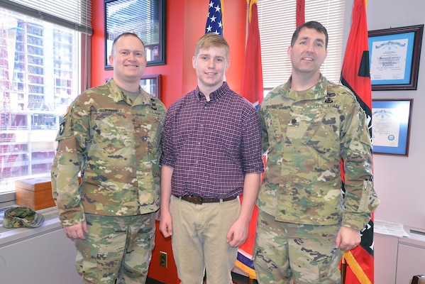 Maj. Christopher Burkhart, Nashville District deputy commander (right) Charles Nissen a sophomore student from Montgomery Bell Academy (center) and Lt. Col. Stephen L. Murphy, Nashville District commander, pose for a photo after Nissen receives a brief on the district.  Nissen, a sophomore student from Montgomery Bell Academy spent the day shadowing U. S. Army Corps of Engineers Nashville District engineers. 

