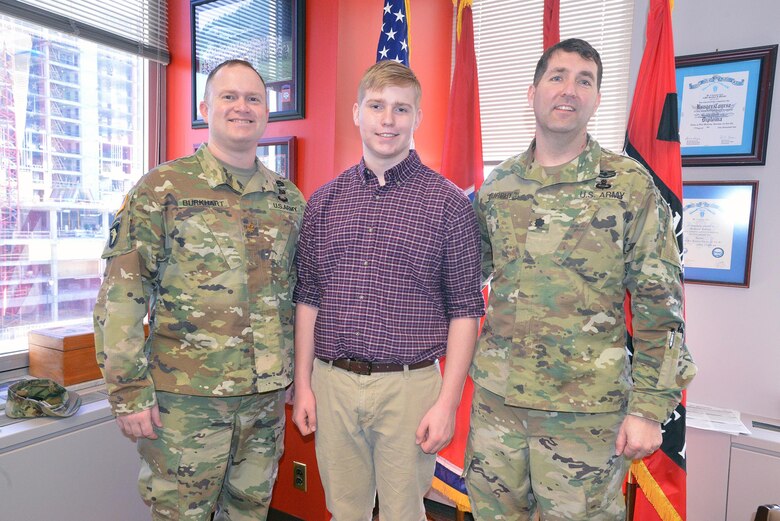 Maj. Christopher Burkhart, Nashville District deputy commander (right) Charles Nissen a sophomore student from Montgomery Bell Academy (center) and Lt. Col. Stephen L. Murphy, Nashville District commander, pose for a photo after Nissen receives a brief on the district.  Nissen, a sophomore student from Montgomery Bell Academy spent the day shadowing U. S. Army Corps of Engineers Nashville District engineers. 

