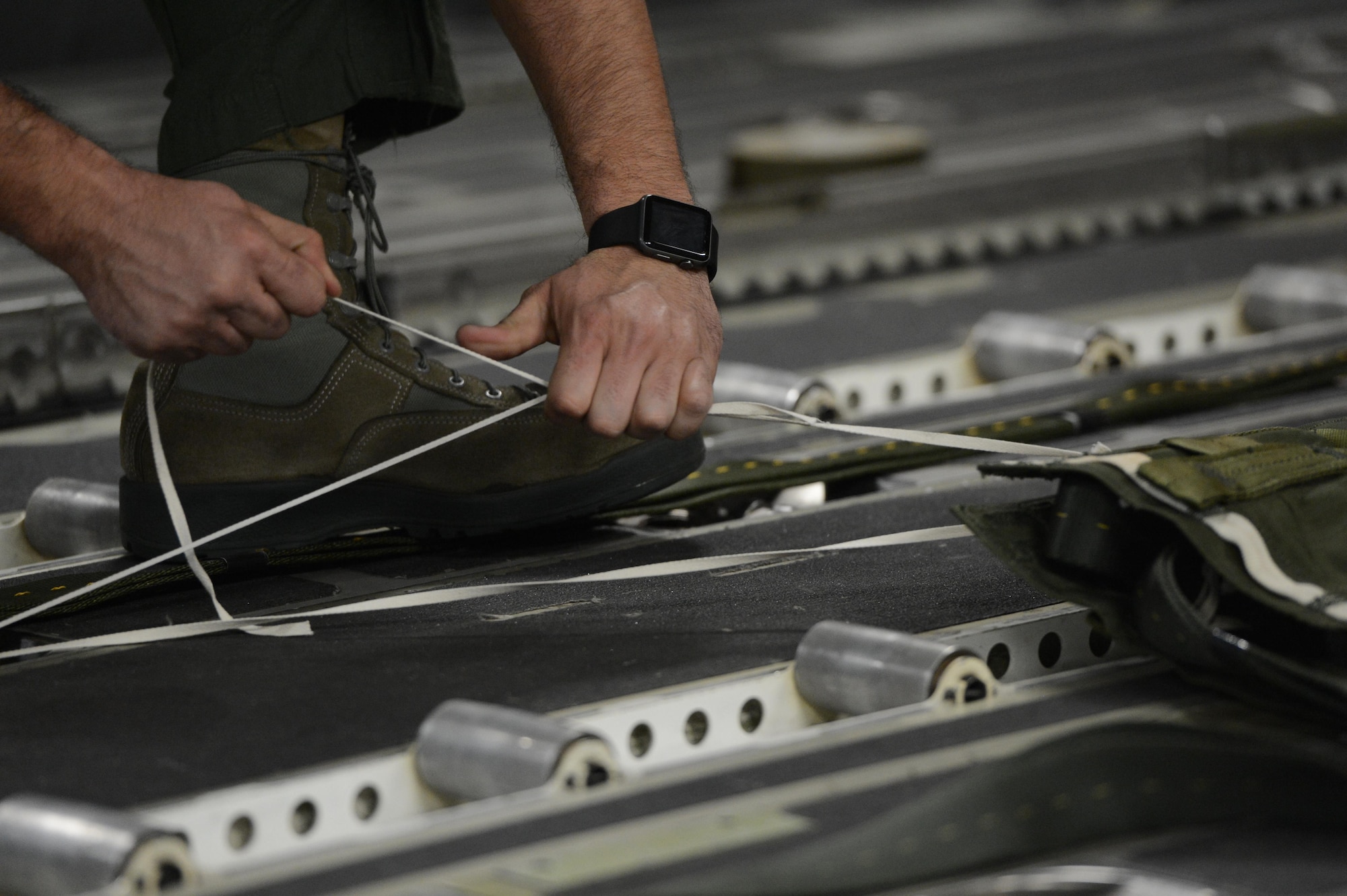 Staff Sgt. Justin Baez, 7th Airlift Squadron loadmaster, prepares a drogue chute aboard a McChord C-17 Globemaster III prior to a heavy equipment drop March 3, 2017, at Pope Army Airfield, N.C. The equipment drop was part of a joint readiness exercise, also known as a Battalion Mass Tac exercise, with Airmen and Army Airborne members. (U.S. Air Force photo by Master Sgt. Sean Tobin)