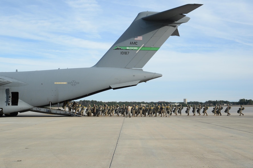 U.S. Army paratroopers from the 82nd Airborne Division board a McChord C-17 Globemaster III prior to a personnel drop March 3, 2017, at Pope Army Airfield, N.C. The exercise took place to provide hands-on training to Air Mobility Command aircrews while supporting Soldiers from the 82nd Airborne Division stationed at Fort Bragg, N.C. (U.S. Air Force photo by Master Sgt. Sean Tobin)
