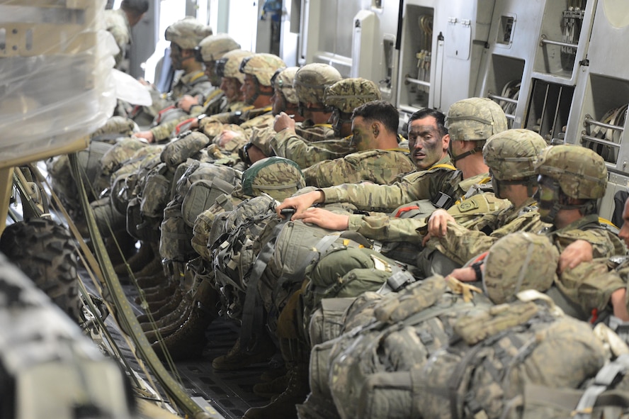 U.S. Army paratroopers from the 82nd Airborne Division sit aboard a McChord C-17 Globemaster III aircraft prior to a static line jump in support of a joint readiness exercise March 3, 2017, at Pope Army Airfield, N.C. During the exercise, U.S. Air Force aircraft dropped more than 2,400 Army personnel. (U.S. Air Force photo by Master Sgt. Sean Tobin)