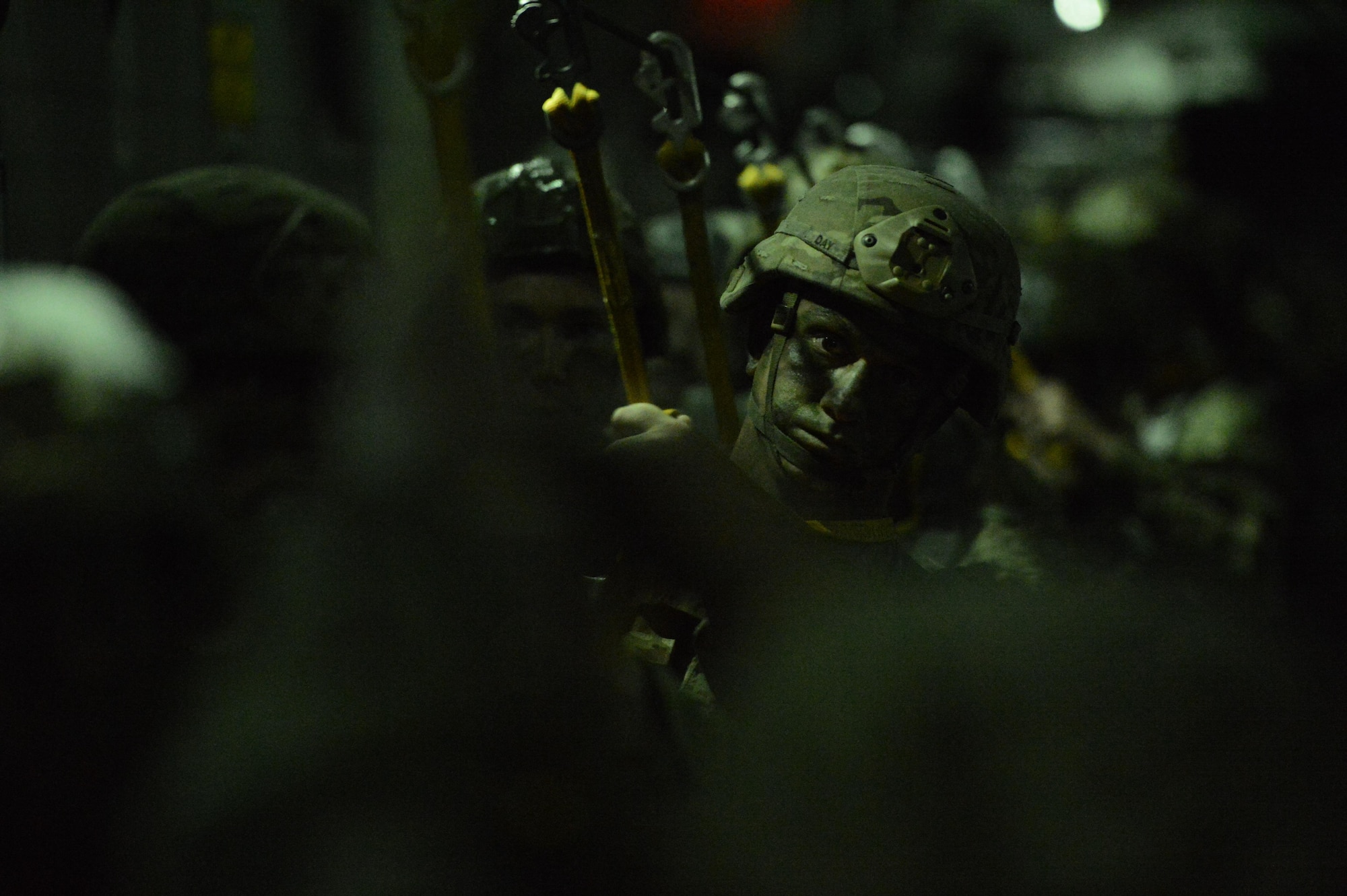 A U.S. Army paratrooper from the 82nd Airborne Division prepares for the green "jump" light prior to a static line jump from a McChord C-17 Globemaster III March 3, 2017, somewhere over Fort Bragg, N.C. The late-night jump took place in darkness in order to exercise a tactical, nighttime infiltration into enemy territory. (U.S. Air Force photo by Master Sgt. Sean Tobin)