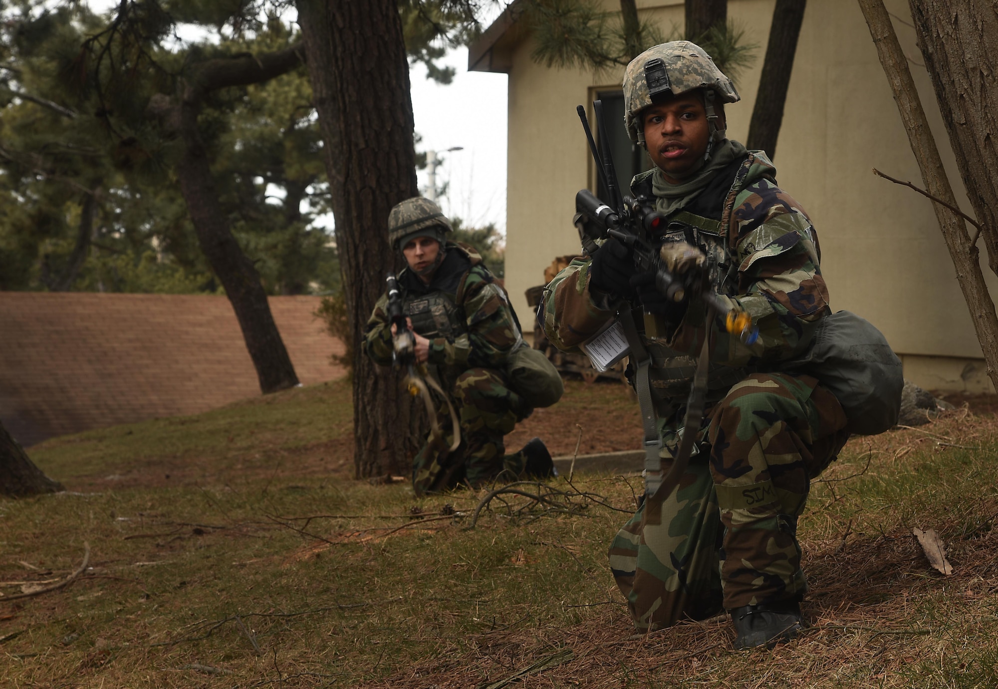 Tech. Sgt. Jeffery Self, front, and Master Sgt. Brian Stokes, 8th Security Forces Squadron team members, advance toward opposing forces during exercise Beverly Pack 17-2, a no-notice training exercise at Kunsan Air Base, Republic of Korea, March 7, 2017. Self and Stokes executed this procedure as part of a scenario used to increase U.S. combat readiness and improve the ability to respond at a moment’s notice. (U.S. Air Force photo by Tech. Sgt. Jeff Andrejcik/Released)