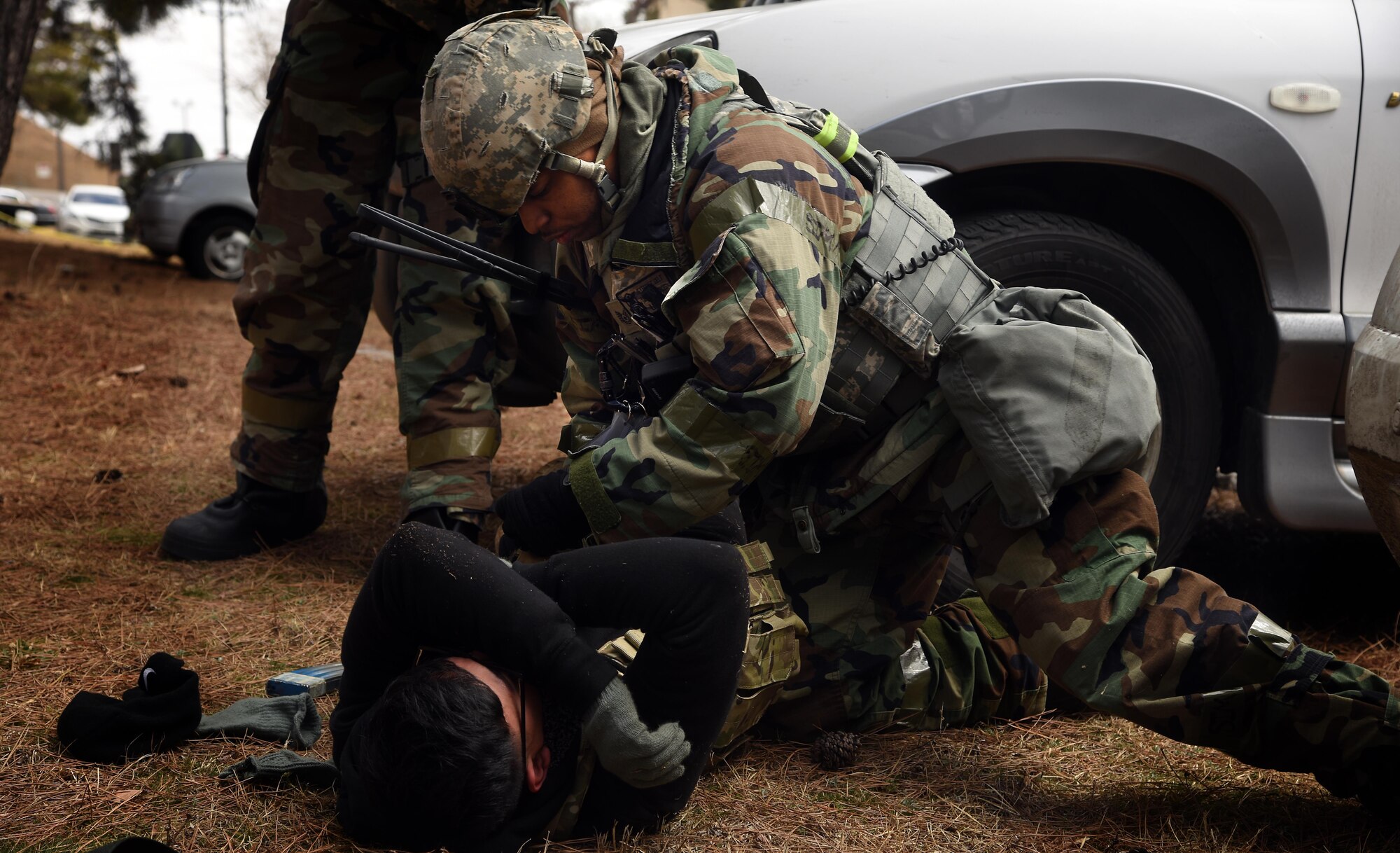 Tech. Sgt. Jeffery Self, 8th Security Forces Squadron team member, searches an opposing force during a training scenario at Kunsan Air Base, Republic of Korea, March 7, 2017. Self performed this procedure as part of exercise Beverly Pack 17-2, a no-notice training exercise used to enhance responses to base threats. (U.S. Air Force photo by Tech. Sgt. Jeff Andrejcik/Released)