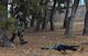 Tech. Sgt. Jeffery Self, 8th Security Forces Squadron team member, advances toward opposing forces during a training scenario at Kunsan Air Base, Republic of Korea, March 7, 2017. Self used the advancing technique as part of exercise Beverly Pack 17-2, a no-notice training exercise used to improve responses to base threats. (U.S. Air Force photo by Senior Airman Colville McFee/Released)