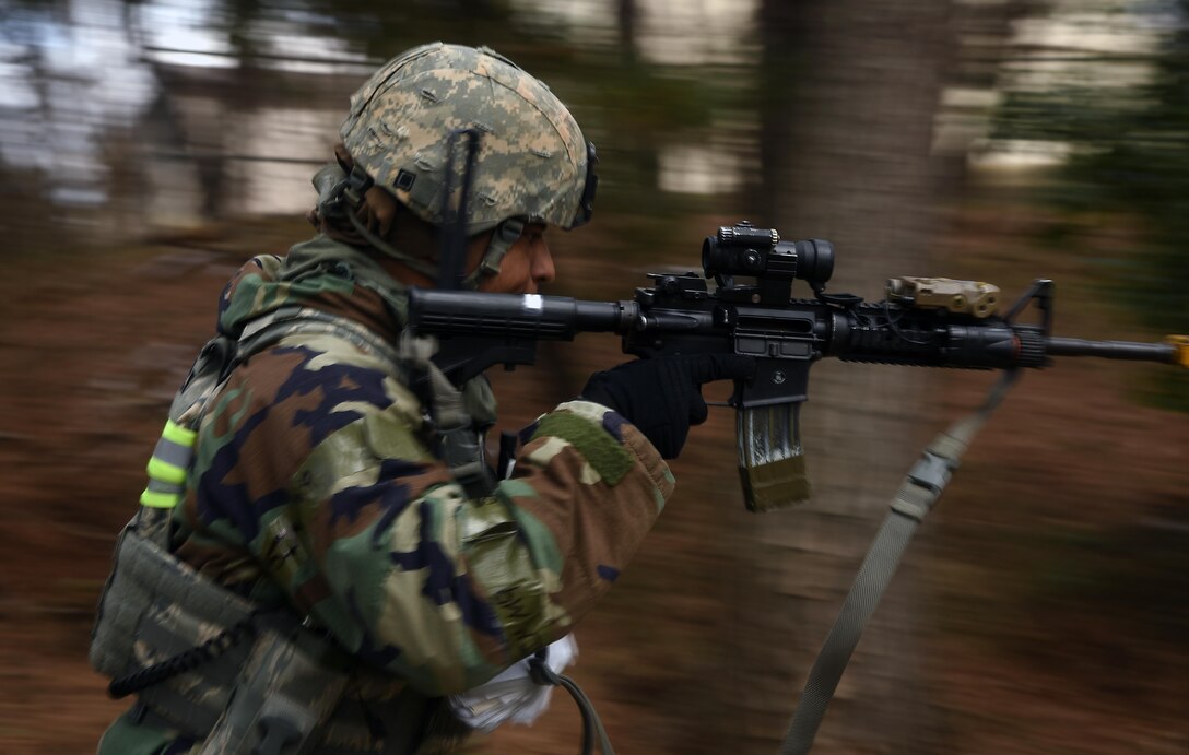 Tech. Sgt. Jeffery Self, 8th Security Forces Squadron team member, advances toward opposing forces during a training scenario at Kunsan Air Base, Republic of Korea, March 7, 2017. Self used the advancing technique as part of exercise Beverly Pack 17-2, a no-notice training exercise used to improve responses to base threats. (U.S. Air Force photo by Tech. Sgt. Jeff Andrejcik/Released)