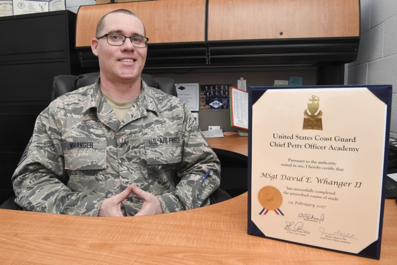 Master Sgt. David Whanger, first sergeant for the 130th Aircraft Maintenance squadron at McLaughlin Air National Guard Base, Charleston W.Va., poses for a portrait with his certificate of completion from the U.S. Coast Guard Chief Petty Officer Academy. (U.S. Air National Guard photo by Tech. Sgt. Eugene Crist)