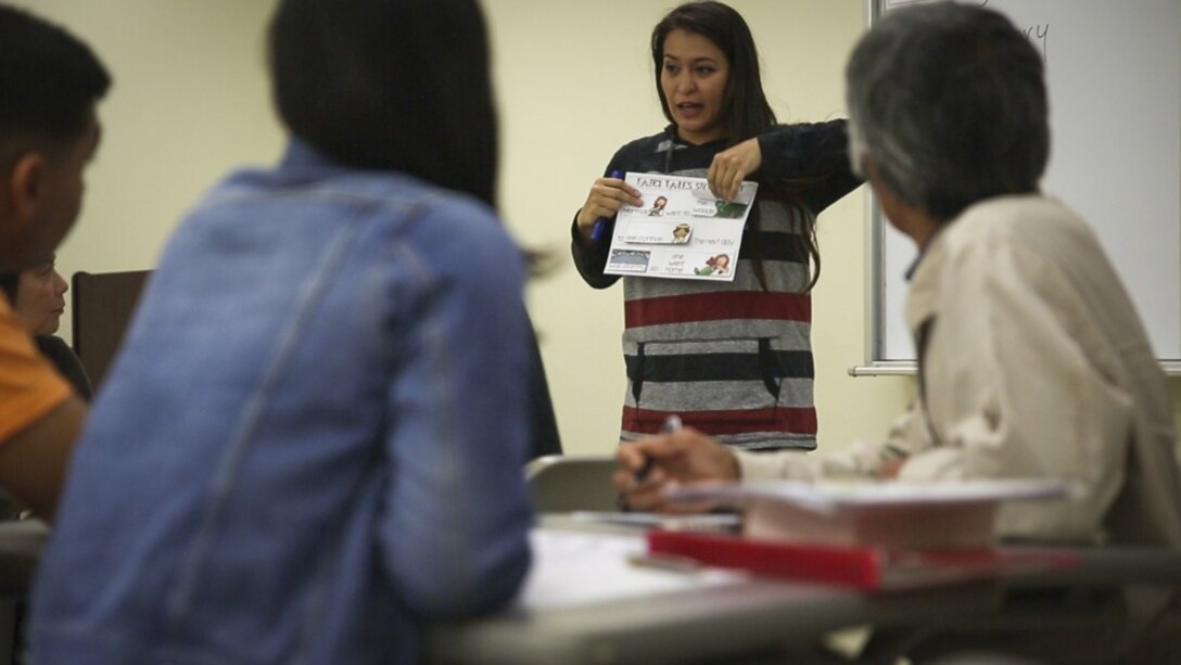 Michelle Camina, wife of Master Sgt. Anthony Camina, teaches Okinawans during the Schwab Intermediate English Class at the Education Center at Camp Schwab, Okinawa, Japan, Feb. 22, 2017. The Education Center hosts a weekly beginner and intermediate English class on Wednesdays to strengthen the bond between Okinawans and service members. The Caminas, from San Antonio, Texas, also instruct the Kin-Hansen Friendship English Class, at the Kin Town Central Community Center, Okinawa, each Tuesday. (U.S. Marine Corps photo by Lance Cpl. Andy Martinez) 