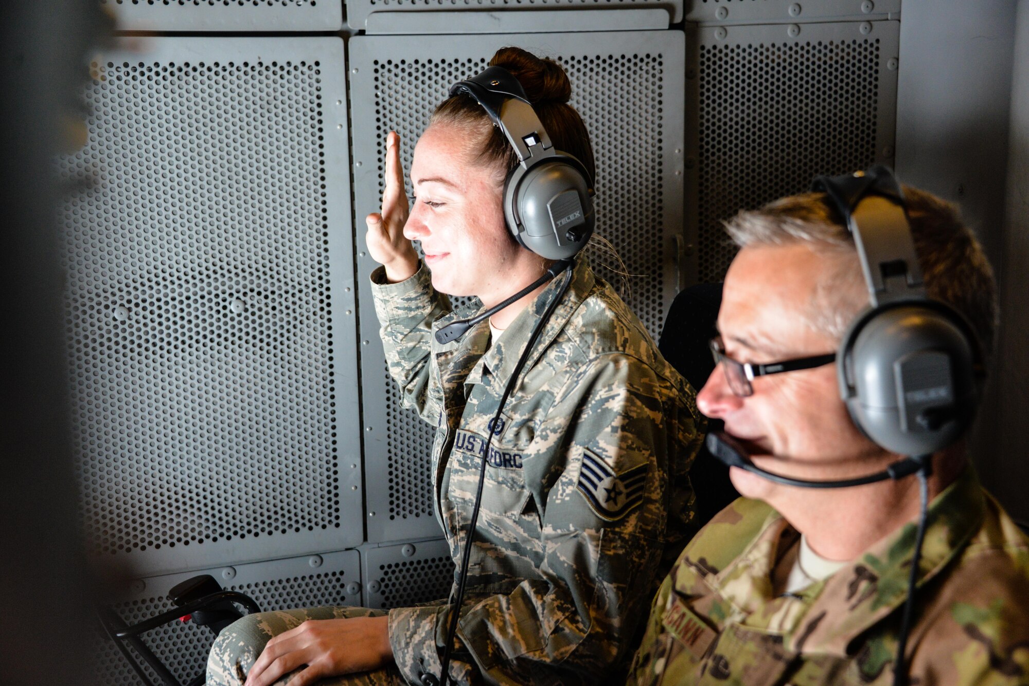 U.S. Air Force Staff Sgt. Rebecca Rains, currently serving in the 380th Expeditionary Operations Support Sq. at an undisclosed location in Southwest Asia, recites the oath of enlistment being administered by her squadron commander and F-22 Raptor pilot, Lt. Col. August Pfluger, March 3, 2017.  The re-enlistment took place while conducting an air refueling in a KC-10 Extender over Syria in support of Combined Joint Task Force-Operation Inherent Resolve.   Pfluger, who just 11 minutes before the re-enlistment had completed his air tasking in Syria, administered the oath while receiving fuel from the KC-10 and over headset from his F-22 Raptor.  Rains re-enlisted for four years. 