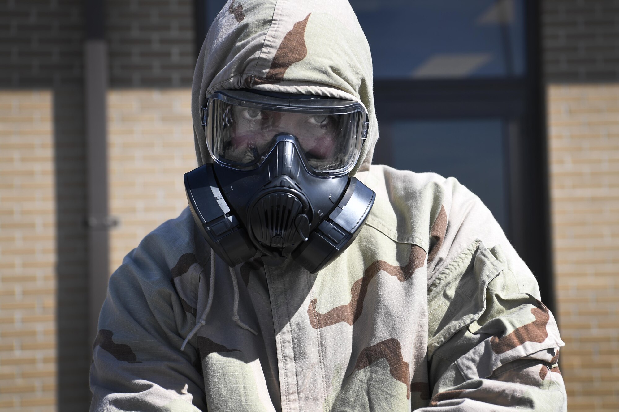 An Airman from the 621st Contingency Response Wing looks through his gasmask during Crisis Response 17 at the Combat Readiness Training Center in Gulfport, Mississippi, March 2, 2017. The 621st CRW arrived on site to establish an aerial port and means of communication before handing the base off to a follow on force of other MDL support personnel. (U.S. Air Force photo/Senior Airman Lauren Russell)